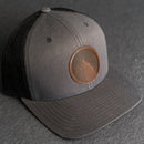 Leather Patch Trucker Style Hat - Wolf Stamp