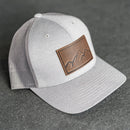 Leather Patch Performance Style Trucker Hat - Mountain Range Stamp