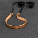 Brown leather sunglasses strap with 'JWP' 