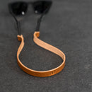 Brown leather strap with 'JWP'