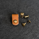Leather strap with brass rivets