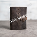 Cheery Mishaps - Refillable Leather Adventure Journals with Buckle Closure