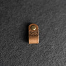 Small brass tag with 'Knot Happens' 