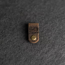 Small leather tag with 'Knit Happens' 