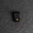 Black leather tag with gold button