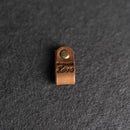 Brown leather tag with 'Made with Love' 
